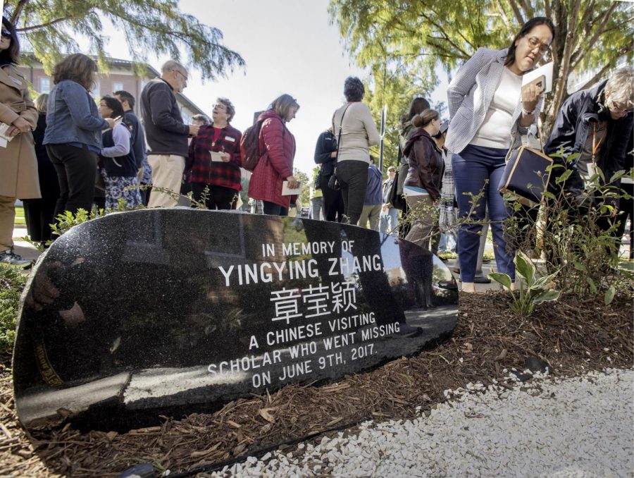 This Oct. 11, 2018, file photo shows guests mingling after a ceremony to dedicate the memorial garden for Yingying Zhang, Chinese scholar who disappeared from campus in June 2017. A judge at the trial of a former University of Illinois student charged with killing a visiting Chinese scholar says lawyers should be ready to deliver opening statements by the middle of next week. Thursday, June 6, 2019, is the fourth day of jury selection at Brendt Christensens trial in Peoria.
