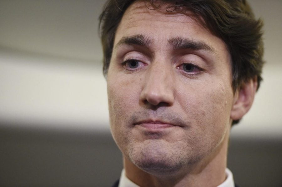 Canadian Prime Minister and Liberal Party leader Justin Trudeau reacts as he addresses a photo of himself from 2001, wearing “brownface,” in Halifax, Nova Scotia, Sept. 18, 2019.