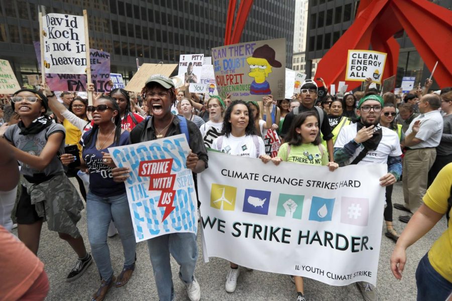 Protesters rally on the Federal Plaza inside the Loop during a global climate change march Friday, Sept. 20, 2019 in Chicago.