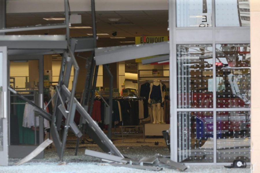 The damaged storefront of the Sears store at Woodfield Mall is seen after a man drove an SUV into the store in the Chicago suburb of Schaumburg, Ill., on Friday, Sept. 20, 2019.