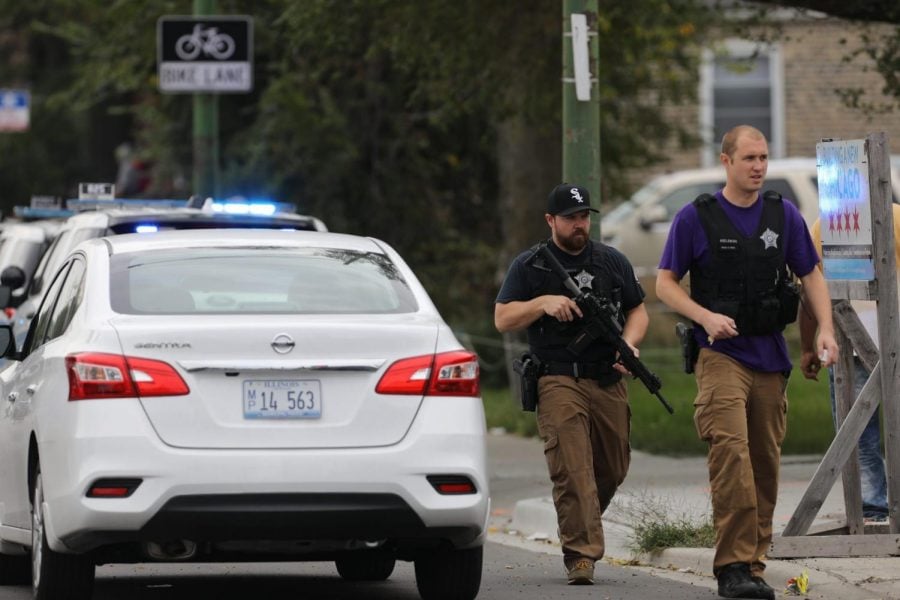 Police search for a suspect that shot a Chicago Police Department officer, near 63rd and Damen, Saturday, Sept. 21, 2019. The shooting happened around 8:40 a.m. 