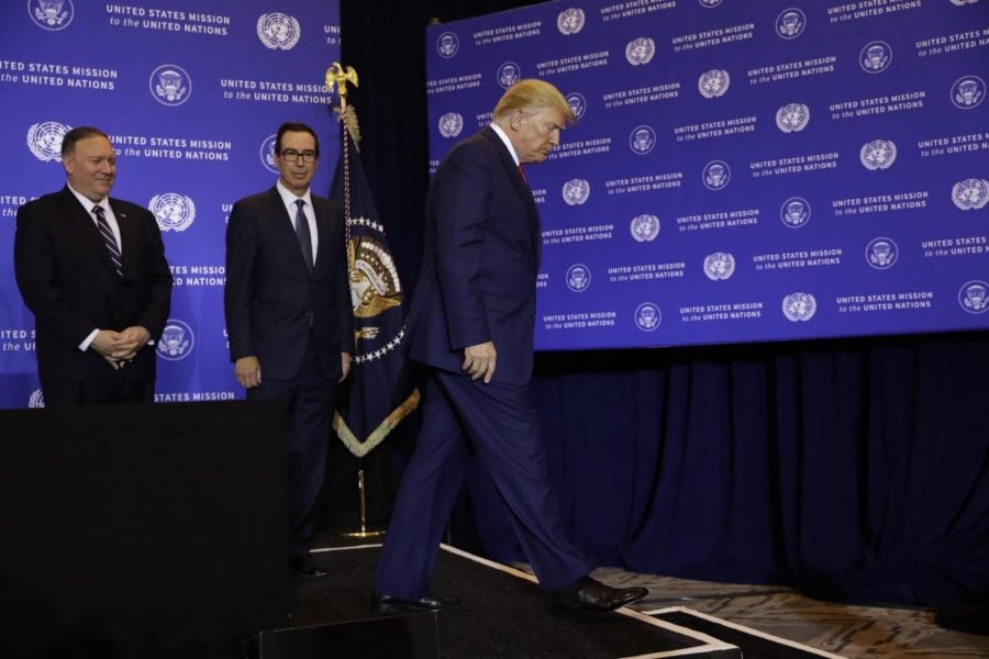 President Donald Trump walks off following a news conference at the InterContinental Barclay New York hotel during the United Nations General Assembly, Wednesday, Sept. 25, 2019, in New York. Secretary of State Mike Pompeo and Treasury Secretary Steve Mnuchin are left. 