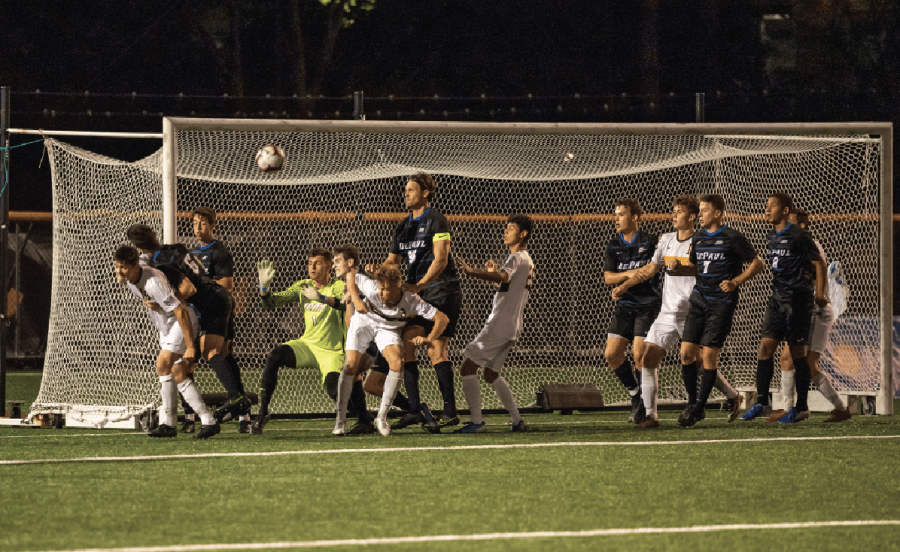 DePaul and Loyola soccer players fight for the ball during a Ramblers corner kick on Friday. DePaul fell to Loyola 4-2 at Hoyne Field.