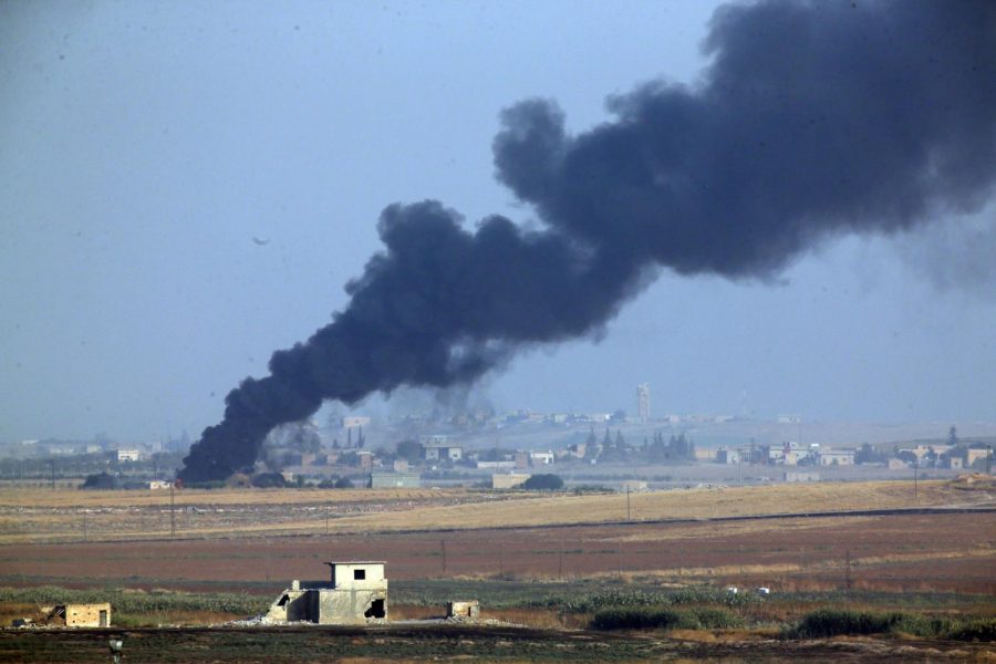 In this photo taken from the Turkish side of the border between Turkey and Syria, in Akcakale, Sanliurfa province, southeastern Turkey, smoke billows from a fire inside Syria during bombardment by Turkish forces Wednesday, Oct. 9, 2019. Turkey launched a military operation Wednesday against Kurdish fighters in northeastern Syria after U.S. forces pulled back from the area, with a series of airstrikes hitting a town on Syrias northern border.