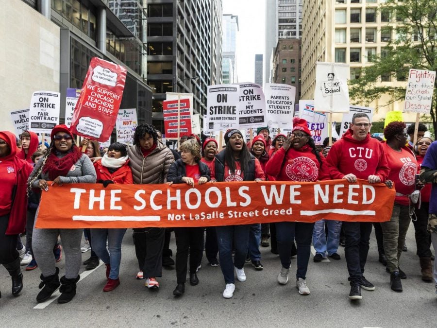 Chicago Teachers Union Vice President Stacy Davis Gates, center, other union officials and their supporters lead thousands of striking union members on a march through the Loop, Thursday, Oct. 17, 2019, in Chicago. Striking teachers went on strike after their union and city officials failed to reach a contract deal in the nations third-largest school district.