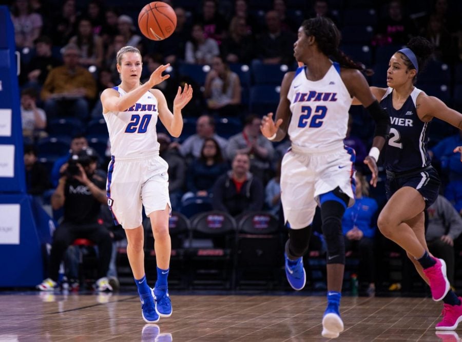 DePaul senior Kelly Campbell passes the ball to her fellow senior teammate Chante Stonewall. 