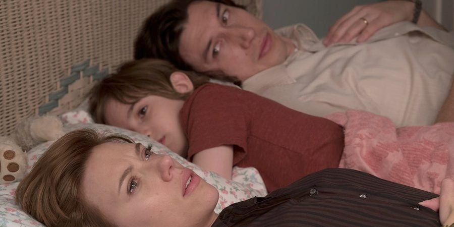 Nicole Barber, played by Scarlett Johansson, holds back tears in bed with her husband, Charlie (Adam Driver), and child. Photo by IMDB