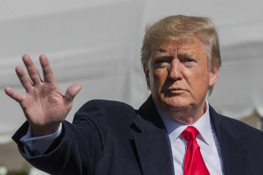President Donald Trump waves after speaking to reporters upon arrival at the White House in Washington, Sunday, Nov. 3, 2019.