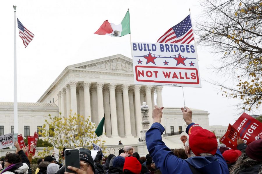 People rally outside the Supreme Court as oral arguments are heard in the case of President Trumps decision to end the Obama-era, Deferred Action for Childhood Arrivals program (DACA), Tuesday, Nov. 12, 2019, at the Supreme Court in Washington.