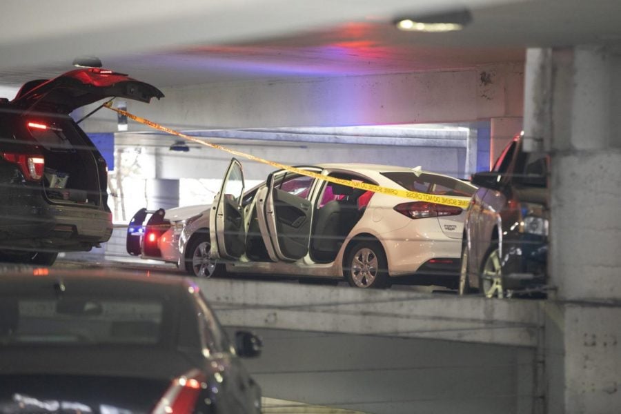 A white vehicle is parked at the scene of a death investigation in a University of Illinois at Chicago parking garage Saturday, Nov. 23, 2019, in Chicago. Authorities say the body of a missing University of Illinois at Chicago student has been found in a car inside campus parking garage.The Cook County medical examiner identified the woman found Saturday as 19-year-old Ruth George of Berwyn.