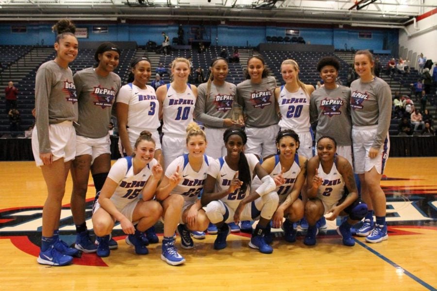 The womens basketball team celebrates after winning the Maggie Dixon Classic on Saturday. 