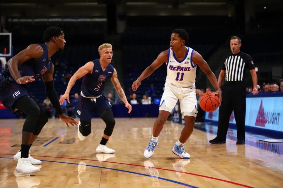 DePaul junior guard Charlie Moore dribbles the ball against Fairleigh Dickinson on Friday at Wiintrust Arena. The Blue Demons won the game 70-59.