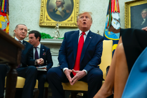 As impeachment hearings open, Trump downplays the moment
