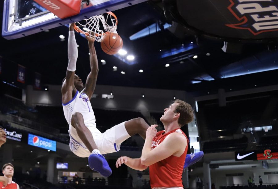 DePaul freshman forward Romeo Weems dunks the ball against Cornell on Saturday at Wintrust Arena.