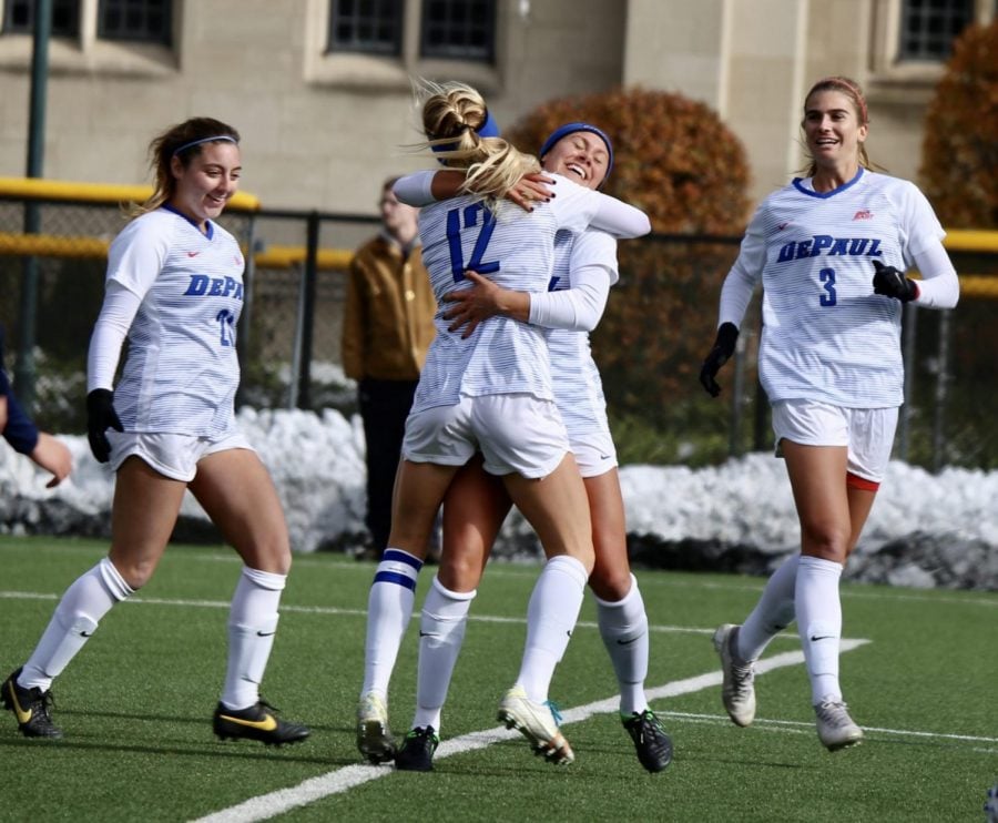 The DePaul women's soccer team celebrates after scoring a goal against Marquette on Friday at Wish Field.
