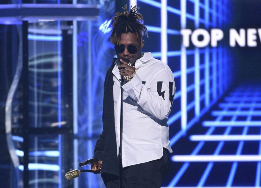 In this May 1, 2019 file photo, Juice WRLD accepts the award for top new artist at the Billboard Music Awards at the MGM Grand Garden Arena in Las Vegas. The Chicago-area rapper, whose real name is Jarad A. Higgins, was pronounced dead Sunday, Dec. 8 after a medical emergency at Chicagos Midway International Airport, according to authorities. Chicago police said theyre conducting a death investigation.