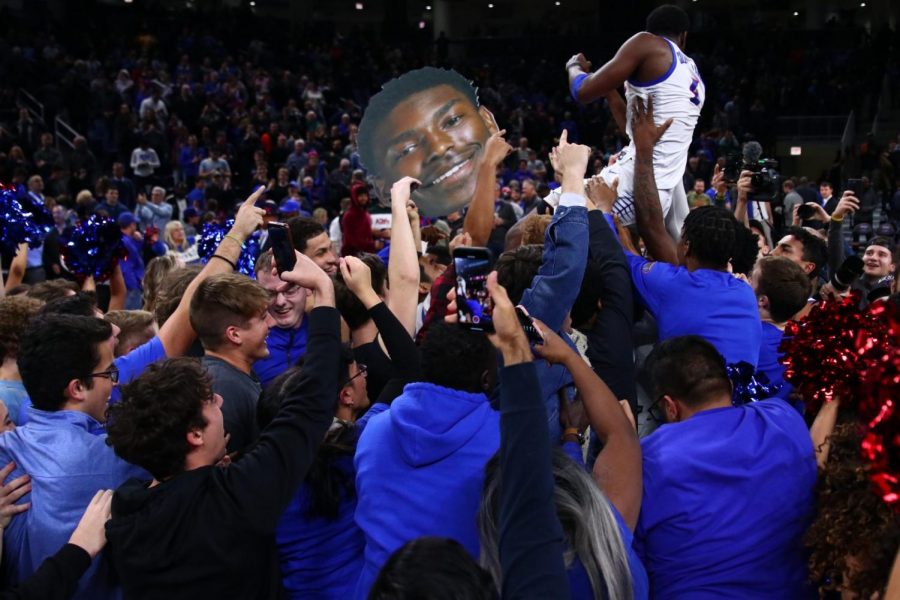 DePaul senior guard Jalen Coleman-Lands gets hoisted into the air by fans after DePaul defeated Texas Tech 65-60 in overtime. 