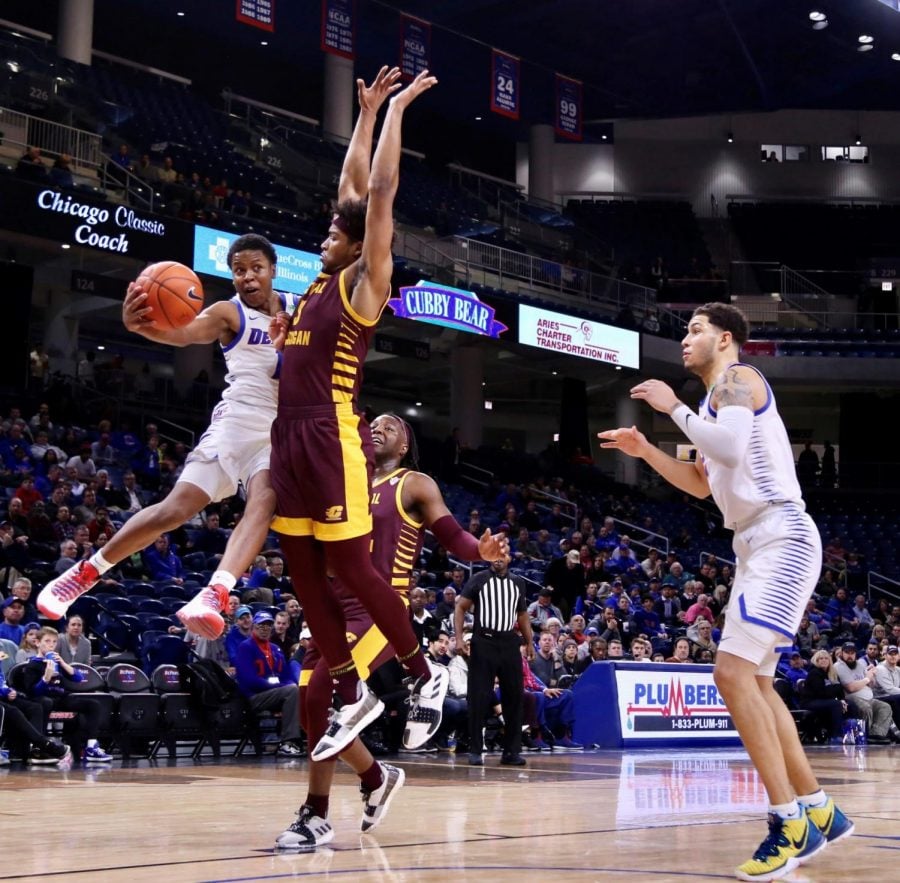 DePaul junior guard Charlie Moore goes for a pass to fellow junior Jaylen Butz against Central Michigan on Nov. 26 at Wintrust Arena.