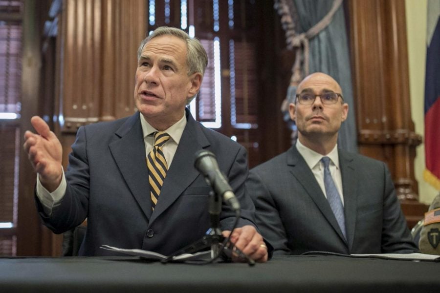 In this June 21, 2019 file photo, Gov. Greg Abbott, left, speaks at a news conference at the Capitol, in Austin, Texas. Abbott says the state will reject the re-settlement of new refugees, becoming the first state known to do so under a recent Trump administration order. 
