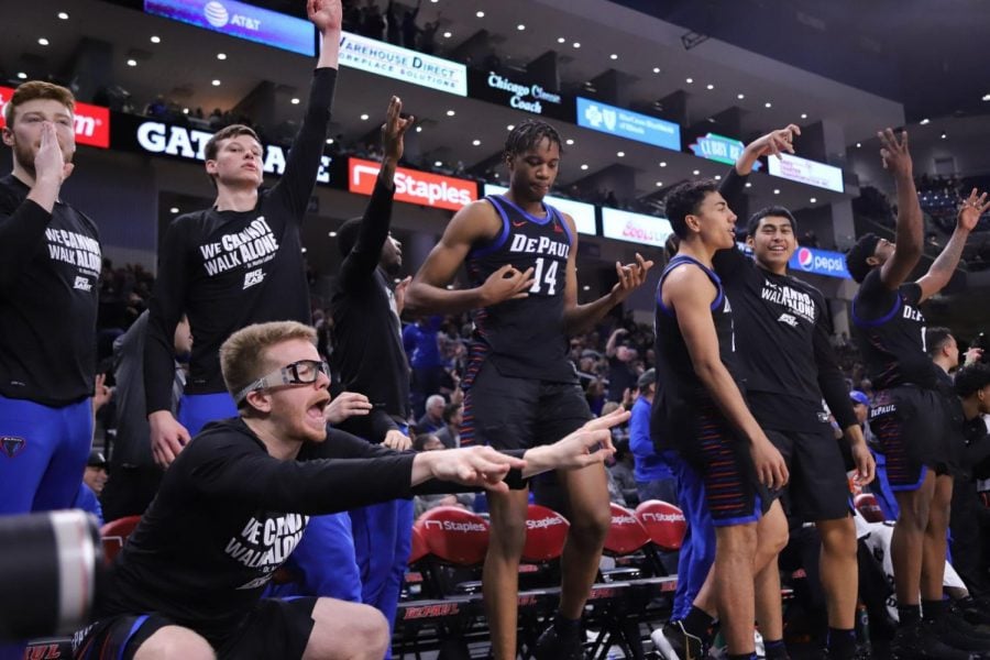 Pantelis Xidias (bottom left) and DePaul’s bench celebrates a three-point shot as the Blue Demons continued to pile up points in the second half Saturday.