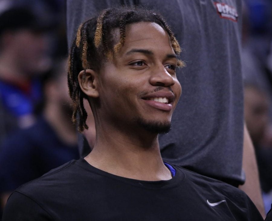 DePaul forward DJ Williams smiles while on the bench before the Blue Demons took on Butler on Saturday at Wintrust Arena.