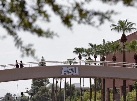 In this July 25, 2018, file photo, pedestrians cross over University Avenue on the campus of Arizona State University in Tempe, Ariz. As concerns about China’s virus outbreak spread, universities all over the world are scrambling to assess the risks to their programs. One diagnosis was confirmed at ASU and another at the University of Massachusetts at Boston, which said the infected student had recently traveled to Wuhan.