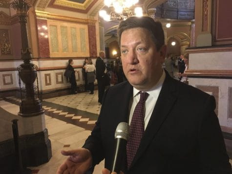 In this March 7, 2018, file photo, Rep. David McSweeney R-Barrington Hills, speaks to reporters at the State Capitol in Springfield, Ill. McSweeney's plan to restrict the use of red-light enforcement cameras, at the center of a former state senator's guilty plea to bribery charges last week in federal court, won House committee approval Wednesday, Feb. 5, 2020.