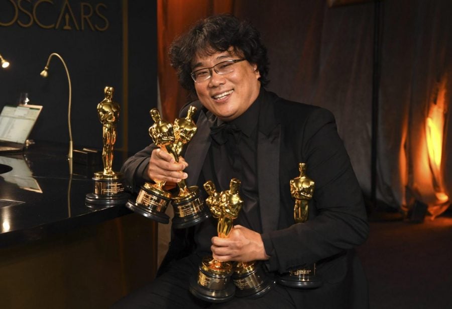 Bong Joon-ho holds the Oscars for best original screenplay, best international feature film, best directing, and best picture for Parasite at the Governors Ball after the Oscars on Sunday, Feb. 9, 2020, at the Dolby Theatre in Los Angeles.