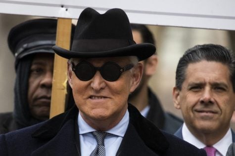 Roger Stone, center, puts his hat on as he departs after his sentencing at federal court in Washington, Thursday, Feb. 20, 2020. President Donald Trump loyalist and ally, Roger Stone was sentenced to over three years in federal prison, following an extraordinary move by Attorney General William Barr to back off his Justice Department's original sentencing recommendation. The sentence came amid President Donald Trump's unrelenting defense of his longtime confidant that led to a mini-revolt inside the Justice Department and allegations the president interfered in the case.
