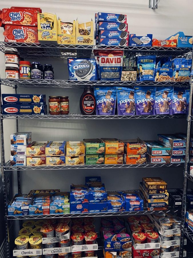 The food pantry is stocked with non-perishables and frozen meals.