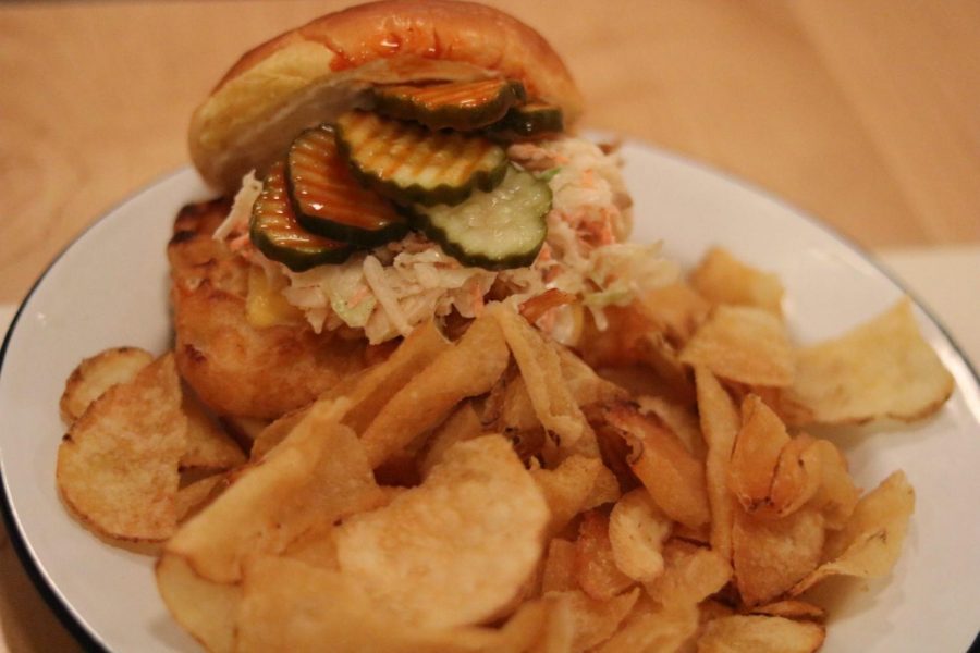 Fish sandwich with slaw, American cheese, hot sauce, aioli and north star pickles served with house-made potato chips.