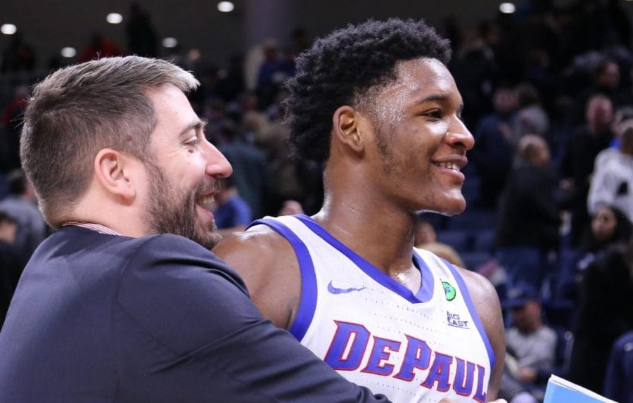 FILE-Asst. Director of Basketball Operations Matt Flemming embraces freshman forward Romeo Weems during his clutch, 18-point performance Saturday night.  