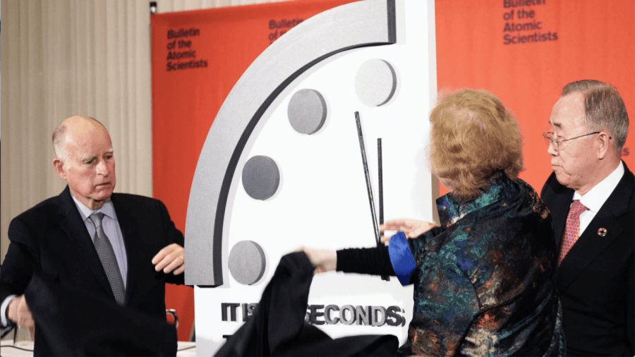 Former California Governor Jerry Brown (left), former Irish President Mary Robinson (middle), and former U.N. Secretary-General Ban Ki-moon reveal the Doomsday Clock.