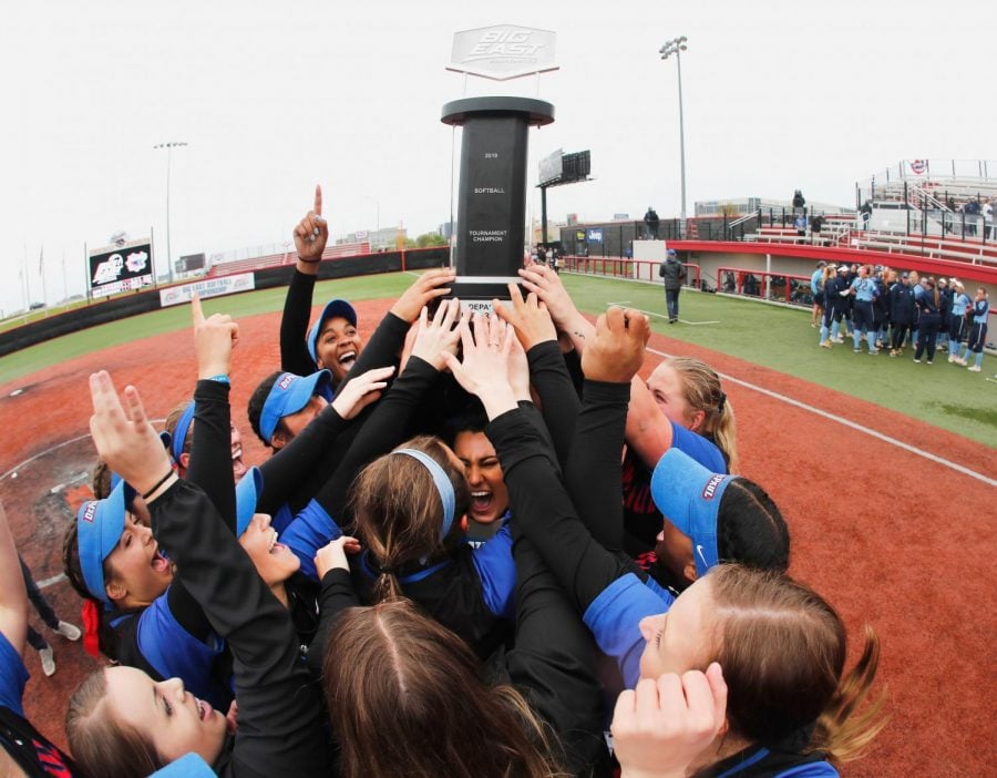 The DePaul softball team holds up the trophy after winning their third straight Big East Tournament title over Villanova, 11-10, on May 11, 2019 in Rosemont, Illinois. 