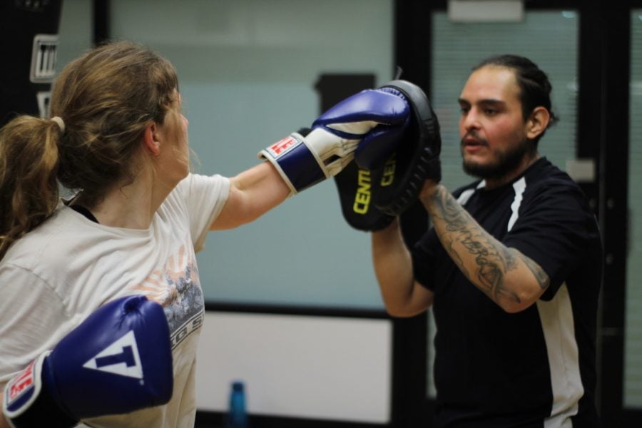 Cameron Chapman (left) trains with a fellow member of the boxing club on Wednesday, Feb. 12 at the Ray Meyer Fitness Center.