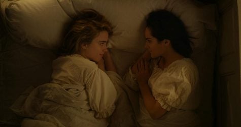 Heloise (played by Adele Haenel) and Marianne (played by Noemie Merlant) lie in bed together in Celine Sciamma’s “Portrait of a Lady on Fire.”