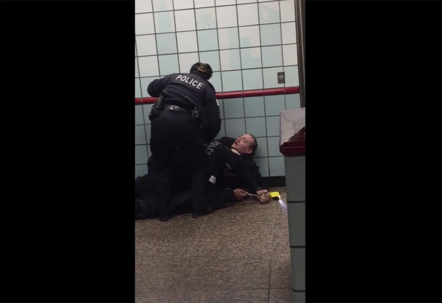 This Friday, Feb. 28, 2020 image from cellphone video shows Chicago police officers trying to apprehend a suspect inside a downtown Chicago train station. After a struggle with police, the suspect was shot as he fled up the escalator with the officers in pursuit. Mayor Lori Lightfoot said video footage of police shooting and wounding the suspect is “extremely disturbing” and that she supports the interim police superintendents request for prosecutors to be sent directly to the scene.