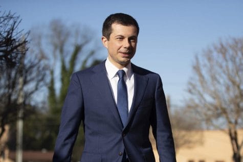 Democratic presidential candidate and former South Bend, Ind. Mayor Pete Buttigieg walks to speaks with members of the media, Sunday, March 1, 2020, in Plains, Ga.