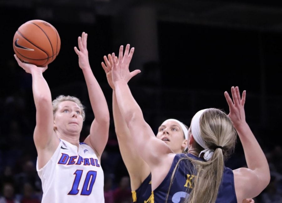 Lexi Held tries a floater over Marquette defenders in her 31 point effort at the 2020 Big East tournament. 