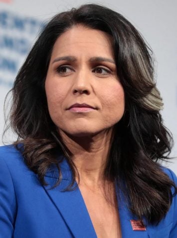 Gabbard ends long-shot 2020 bid, gives support to Biden