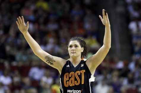 In this July 22, 2017 file photo, Chicago Sky's Stefanie Dolson raises her hands in the second half of the WNBA All-Star basketball game in Seattle. Dolson says she tested positive for the cororavirus. She is the first known Chicago professional athlete and the second WNBA player known to have contracted COVID-19. Dolson announced that she caught the virus in a video that aired Friday, April 17, 2020 during ESPN's broadcast of the WNBA draft.