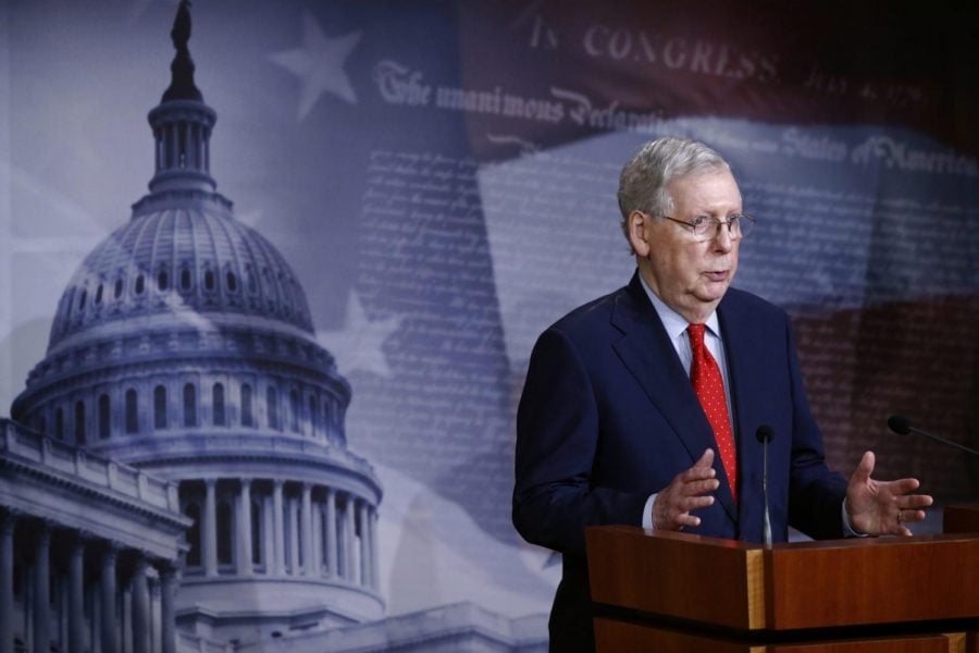 Senate Majority Leader Mitch McConnell of Ky., speaks with reporters after the Senate approved a nearly $500 billion coronavirus aid bill, Tuesday, April 21, 2020, on Capitol Hill in Washington.