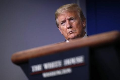In this April 22, 2020, file photo, President Donald Trump listens during a briefing about the coronavirus in the James Brady Press Briefing Room of the White House, in Washington. After two months of frantic response to the coronavirus pandemic, the White House is planning to shift President Trump’s public focus to the burgeoning efforts aimed at easing the economic devastation.