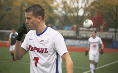 DePaul sophomore forward Jake Fuderer looks onto the field as pouring rain comes down on Oct. 27, 2019. 