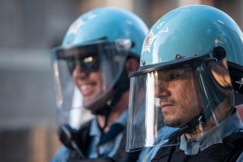 Two officers wearing protective facial coverings.