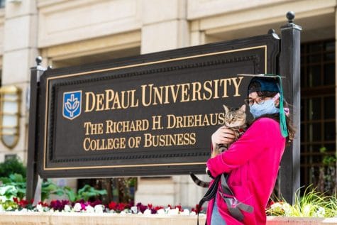 Business school alum Hannah Judson took graduation photos with her cat for a more lighthearted feel.