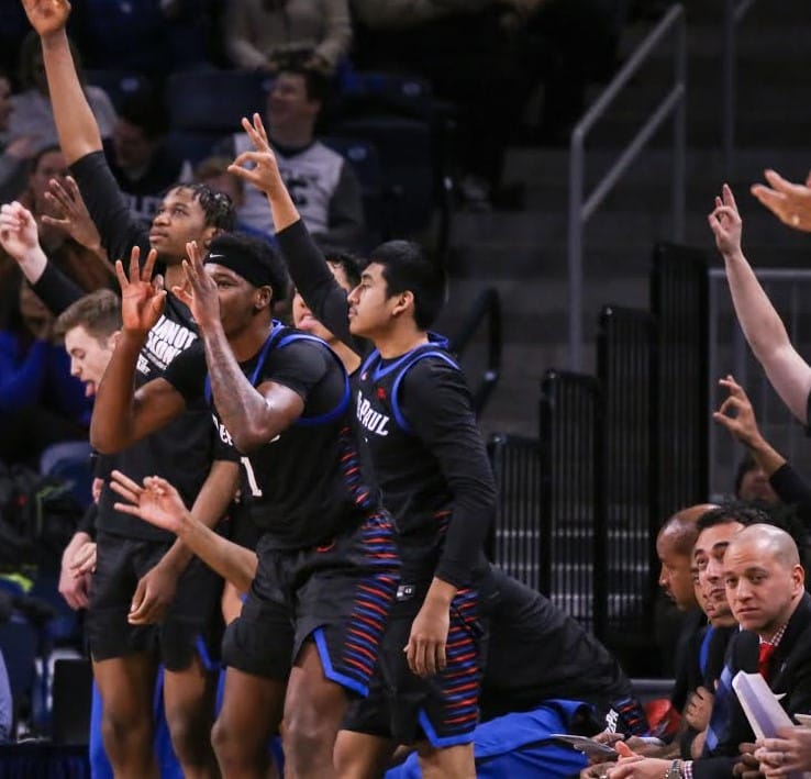 DePaul men's basketball assistant coaches Marc Hsu looks on from the bench last season.