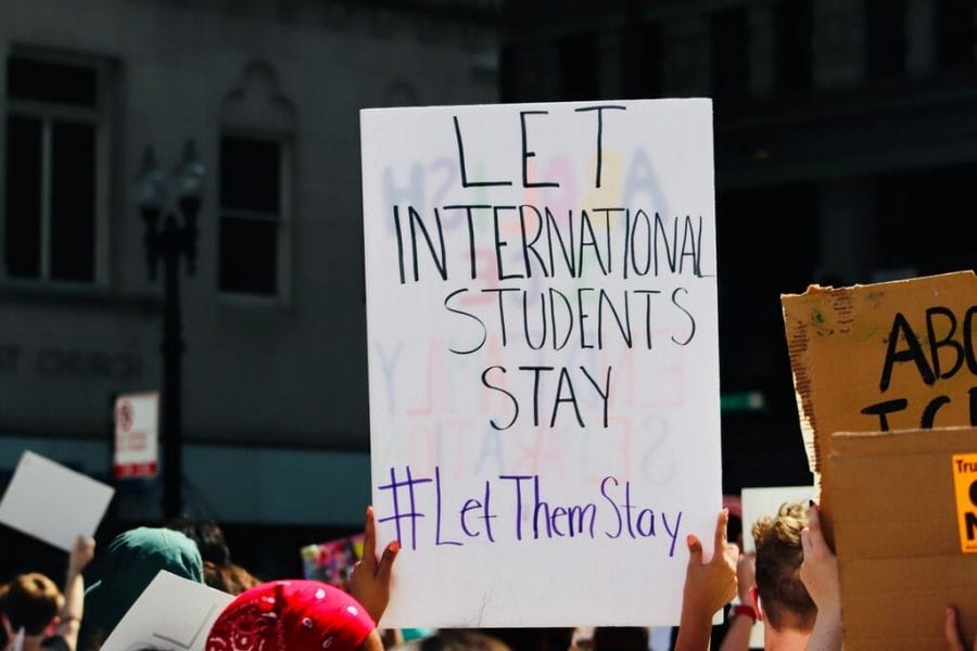 A protester holds a sign outside of Chicago's Immigration and Custom Enforcement center on July 10, 2020.