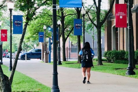 A student walks along the Quad, located in Lincoln Park.