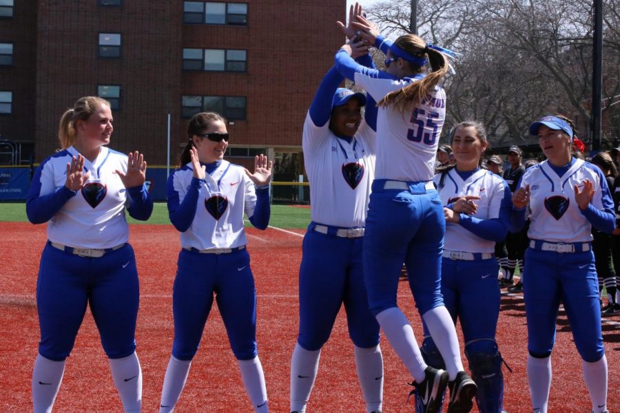 Morgan Greenwood celebrates with her teammates after defeating Providence on April 13, 2019.